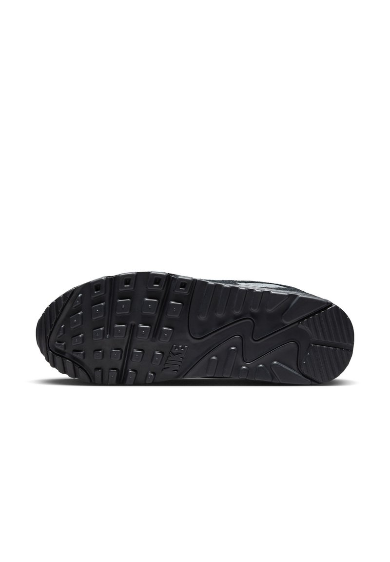 Suela de zapatilla Nike en goma negra, con una superficie texturizada, profundas ranuras y un logo Swoosh. Diseñada para ofrecer tracción y durabilidad.