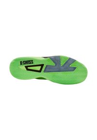 Suela de zapato K-Swiss con una base de goma verde texturizada y un patrón en zigzag, con acentos grises; logo impreso a un lado.