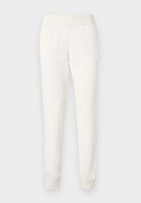 Κρεμ παντελόνι jogger από απαλό ύφασμα, με εφαρμοστό κορδόνι στη μέση και μανσέτες. Απλός σχεδιασμός χωρίς ορατά μοτίβα ή διακοσμήσεις.