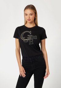 Guess STUDDED - T-shirt con stampa - jet black a