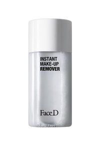 Bottiglia di plastica trasparente con un tappo bianco. L'etichetta riporta "STRUCCANTE ISTANTANEO" in carattere grassetto nero. Il prodotto appare leggermente schiumoso.