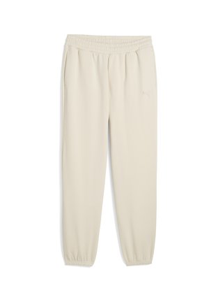 Puma beige joggers lavet af blødt stof, med elastisk talje og manchetter ved anklerne. Diskret logodetalje på siden.