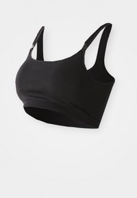Schwarzer nahtloser Bralette mit verstellbaren Trägern, aus weichem Material und mit einem breiten Band. Keine Bügel, entworfen für Komfort und Unterstützung.