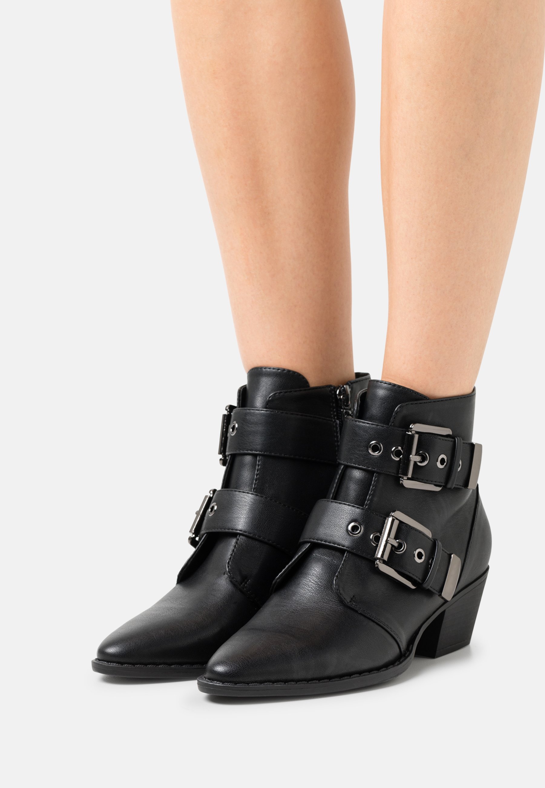 black pointed buckle boots