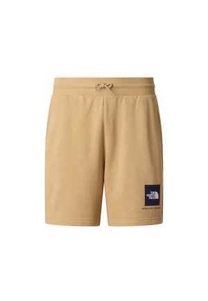 Pantaloncini in cotone color marrone chiaro con vita elastica e coulisse. Presentano una toppa con logo blu e testo sulla gamba sinistra. Texture morbida.