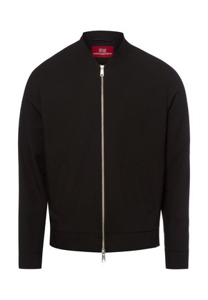 Black bomber jacket with front silver zipper, side pockets, and a red label inside the collar.