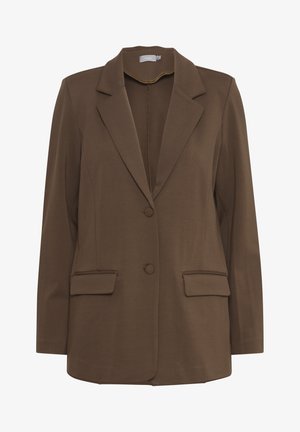 Pruun bleiser pehmest kangast, millel on lõigatud krae, kaks eesmist taskut ja kaks nuppu. Lihtne ja minimalistlik disain.