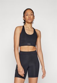 Salomon SHKOUT CORE BRA - Sports-BH-er med medium støtte - deep black