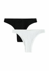 Dos pares de tangas: una negra y una blanca. Ambas tienen una superficie texturizada y un diseño de tiro bajo.