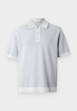 Light gray polo shirt with a textured pattern, short sleeves, and a contrasting white collar and hem. Three button placket at the front.