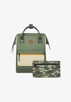 Green fabric backpack with beige accents, front zip pocket, and leather handle; includes a green camo pouch with zip closure.