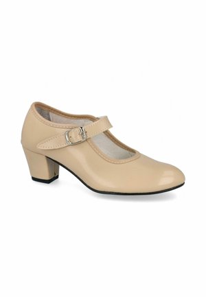 Zapato Mary Jane beige con tacón bajo de bloque y correa ajustable con hebilla, acabado en cuero liso, punta redondeada y suela negra.