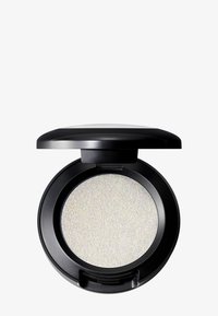 Rund, sort kompakt med et silkeagtigt, iriserende hvidt pudder indeni. Låget er glat og let buet, med en sikker lukning.