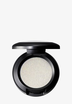 Rond, zwart compact met een zijdezachte, iriserende witte poeder binnenin. Het deksel is glad en licht gewelfd, met een veilige sluiting.