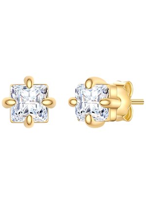 Boucles d'oreilles en or avec de grands cristaux carrés en zircon cubique transparent. Les pierres sont solidement maintenues par quatre griffes arrondies.