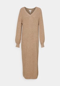 Robe en tricot beige avec un décolleté en V, des manches bouffantes longues et une coupe droite. Le tissu présente une texture côtelée et tombe en dessous du genou.