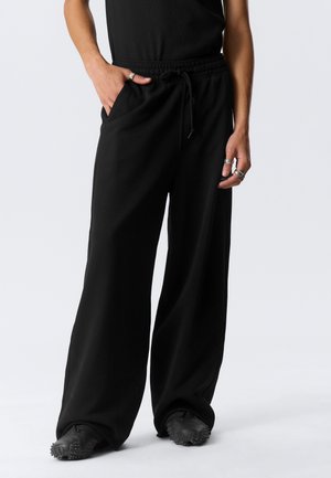 Weekday ASTRO LOOSE UNISEX - Pantalones deportivos - black