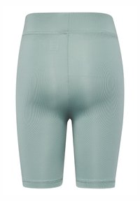 Mintgröna, figurnära shorts i stretchmaterial, med en slät yta och en midja med minimal sömnadsdetalj.
