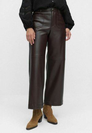 Wide-leg trousers made of dark brown faux leather, featuring front pockets, a button closure, and a smooth, shiny texture.