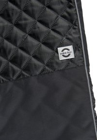 Black quilted fabric with a diamond pattern, featuring a smooth panel below and a white label with the "mikk-line" logo. Grey trim accents.