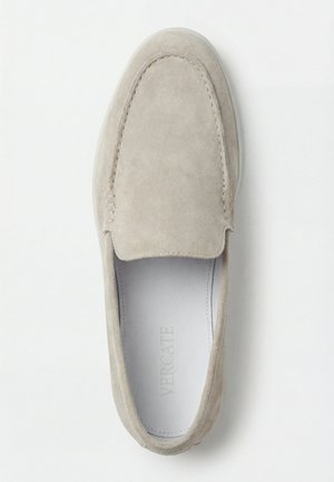 Light beige suede slip-on loafer with stitched moc toe and white insole branded "Vercate," displayed on a white background.