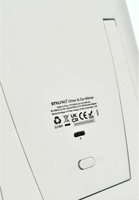 Glow & Go Mirror, white plastic, features a USB-C port, power switch labeled 'ON/OFF', and an information sticker with compliance details.