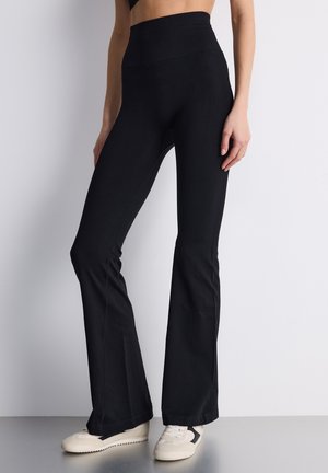 A ZAMPA CON  - Leggings - nero