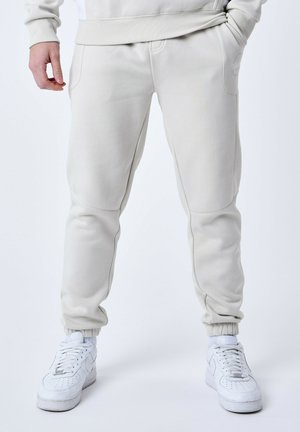 SIGNATURE CERCLE - Tracksuit bottoms - greige