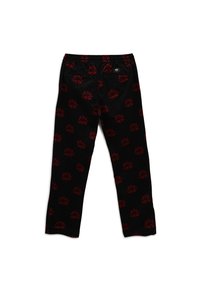 Pantalon noir avec un motif floral rouge, doté d'une taille élastique et de deux poches arrière. Tissu lisse avec une coupe slim.