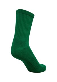 Grön bomullssocka med ribbad textur, ankellängd, och sömlös tåkonstruktion. Inga synliga mönster eller detaljer.