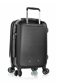 Black hard-shell suitcase with a textured surface, telescoping handle, four spinner wheels, and side handle for easy maneuverability.