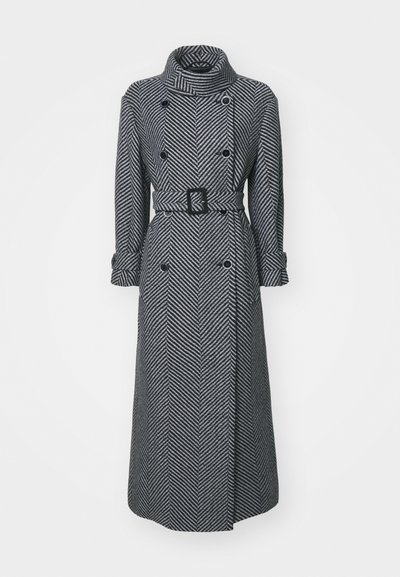 Long, double-breasted trench coat in herringbone pattern, gray and black. Features a belted waist, large buttons, and a high collar.