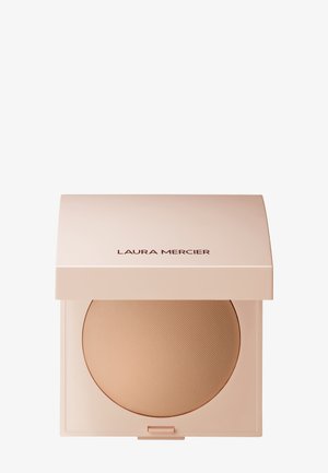 Laura Mercier gjennomsiktig pudderkompakt med en myk rosa ytre. Har en jevn, sirkulær pudderflate og et teksturert mønster.