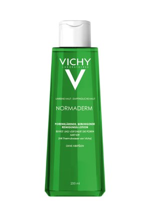 Green plastic bottle of Vichy Normaderm cleansing lotion, featuring a pump top, a minimalist design, and printed text on the front, 200 ml.