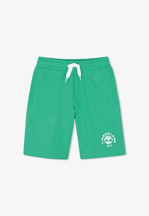 Shorts décontractés verts avec cordon blanc, poches latérales, et logo Timberland blanc avec graphique d'arbre et "1973" sur la jambe gauche.