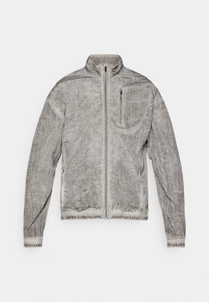 Gray zip-up jacket with a textured surface, high collar, and a chest pocket. Features elastic cuffs and hem for a fitted look.