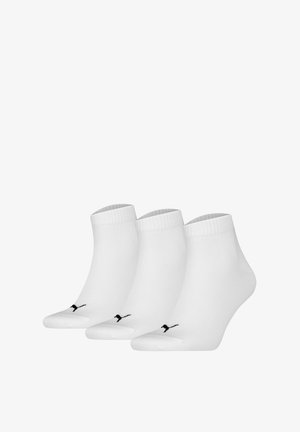 White ankle socks made of cotton blend; features ribbed cuffs and a black logo. Set of three pairs with a smooth texture.