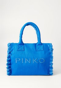 Sininen kangaskassi, jossa on fringed-reunat, yläkahvat ja kohokuvioitu "PINKO" -logo edessä. Rakenne on jämäkkä.