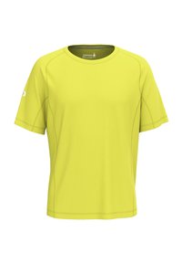 Kortærmet aktiv t-shirt lavet af lyst gult stof, med rund halsudskæring, flade sømme og et logo på venstre ærme.