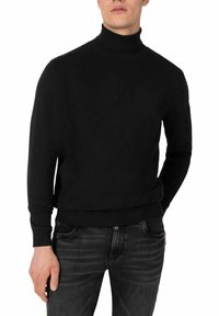 Schwarzer Rollkragenpullover aus weichem Stoff, mit langen Ärmeln und tailliertem Schnitt, mit geripptem Ausschnitt und Saum.