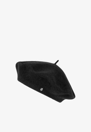 Black wool beret with small top loop and silver emblem on side, set against a white background.
