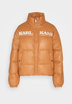Padded orange jacket with high collar, zip closure, and side pockets. Features embossed "KARL KANI" lettering on the chest. Smooth leather texture.