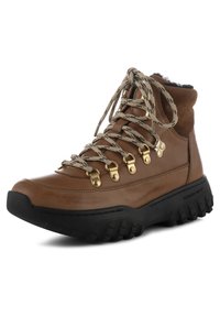 Brown leather hiking boot with a suede collar, metal eyelets, and thick black rubber sole featuring a textured grip pattern.