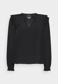 Blusa nera a maniche lunghe con scollo a V, dettagli arricciati sulle spalle e sui polsini. Realizzata in un tessuto leggero e morbido. Design minimalista.