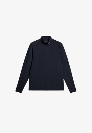 Donkerblauwe pullover met lange mouwen en een halve ritskraag. Gekenmerkt door een gladde, rekbare stof met subtiele textuur en minimale ontwerpaccenten.