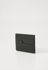 Black leather cardholder with a textured surface, featuring four card slots and a central cut-out for easy access. Compact rectangular shape.