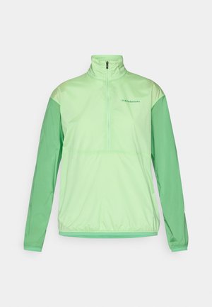 Lichtgroene half-zip jas met lange mouwen. Gemaakt van een soepele, lichte stof. Heeft contrasterende donkerdere groene mouwen en elastische manchetten.