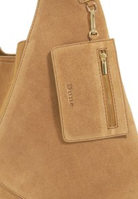 Tan suede handbag featuring a zippered pocket and gold-tone hardware, with a textured finish and embossed brand tag.