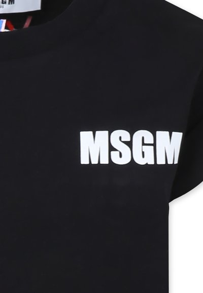 T-shirt in cotone nero con logo "MSGM" stampato in bianco. Girocollo e maniche corte. Texture liscia con un design a tinta unita.