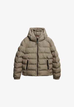 Giacca a vento in beige con cappuccio. Caratterizzata da trapuntatura orizzontale, chiusura frontale con zip e due tasche laterali con zip. Finitura testurizzata.